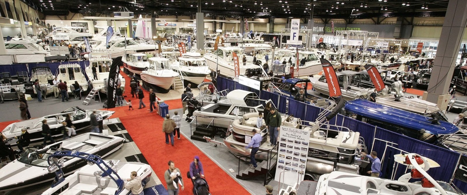 People wandering around the Seattle Boat Show indoor at Lumen Field Event Center