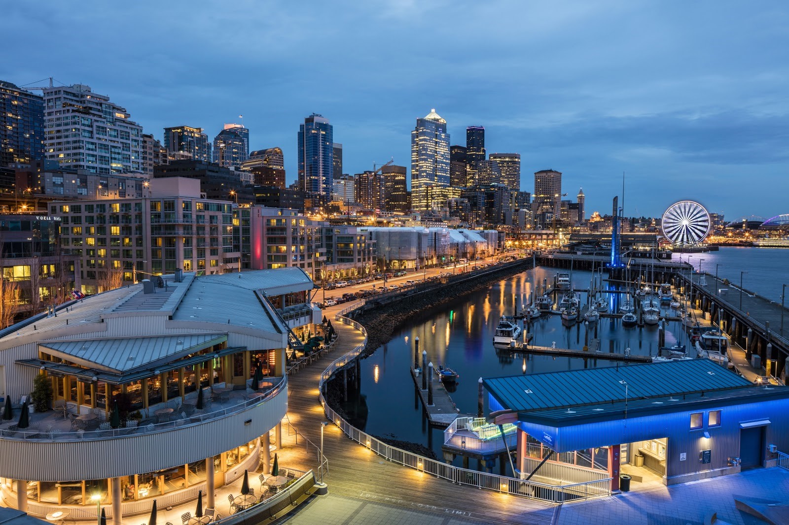 Photo of Bell Harbor and the Seattle waterfront in the evening with the ferris wheel in background