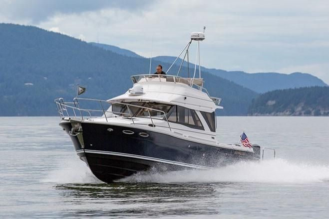 Cutwater C-32 Command Bridge moving fast in the San Juan Islands 