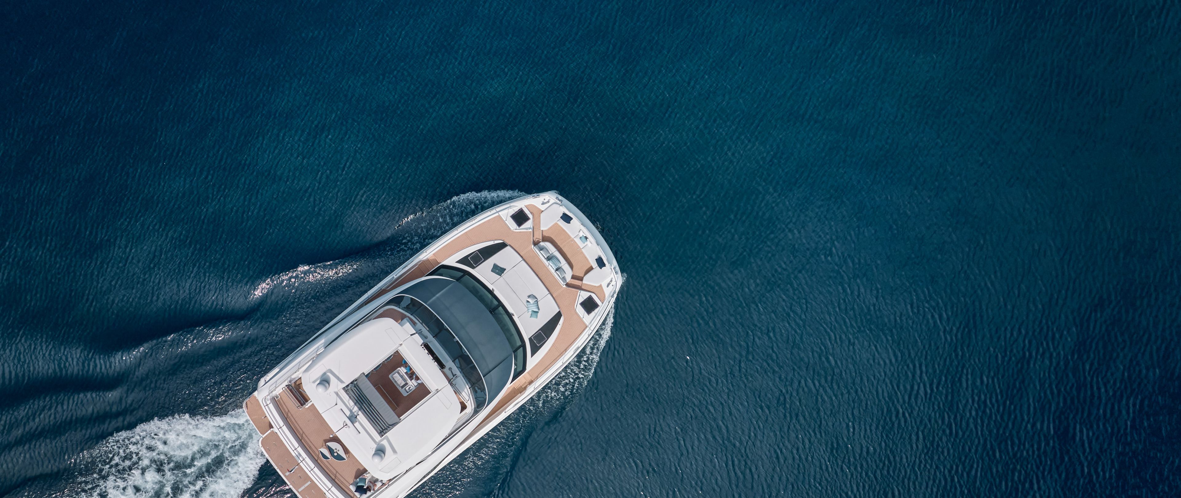 Drone photo of the Prestige M8 looking down, surrounded by deep blue water