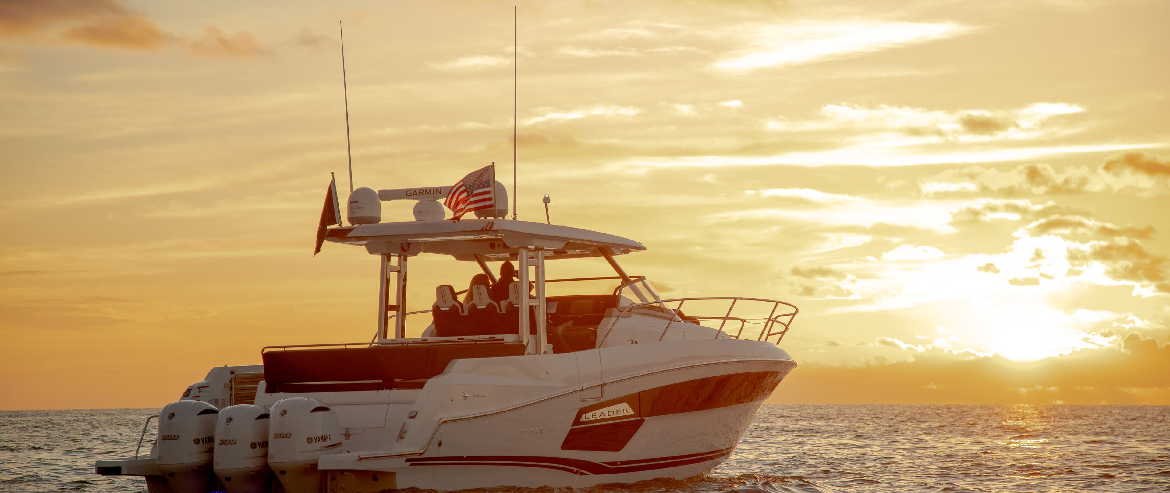 Jeanneau Leader 12.5 WA at sunset on the open sea 