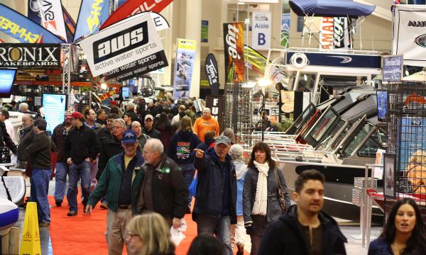 People walking around at the indoor Portland Boat Show