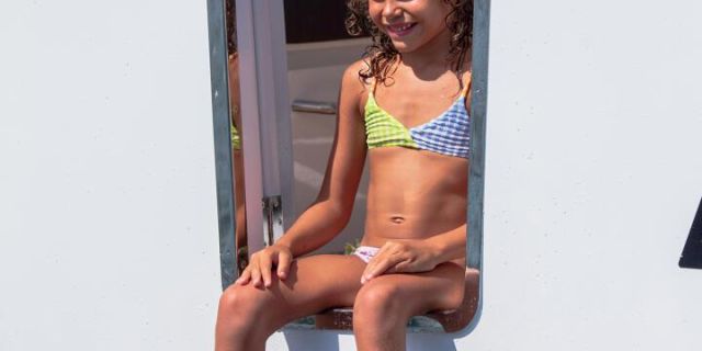 Young girl making use of the starboard side boarding door on the 895 Series 2