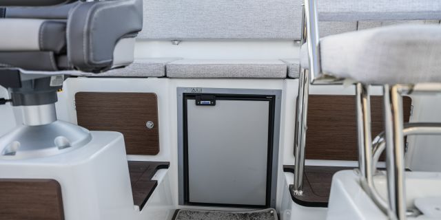 Fridge below a seat in the 795 Sport