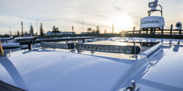 Top of the 795 Sport with roof racks, light bars, sunset in background