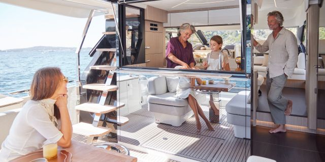 Cockpit bar with opening window to galley