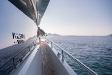 Looking down the side deck of a Prestige Yacht on the water