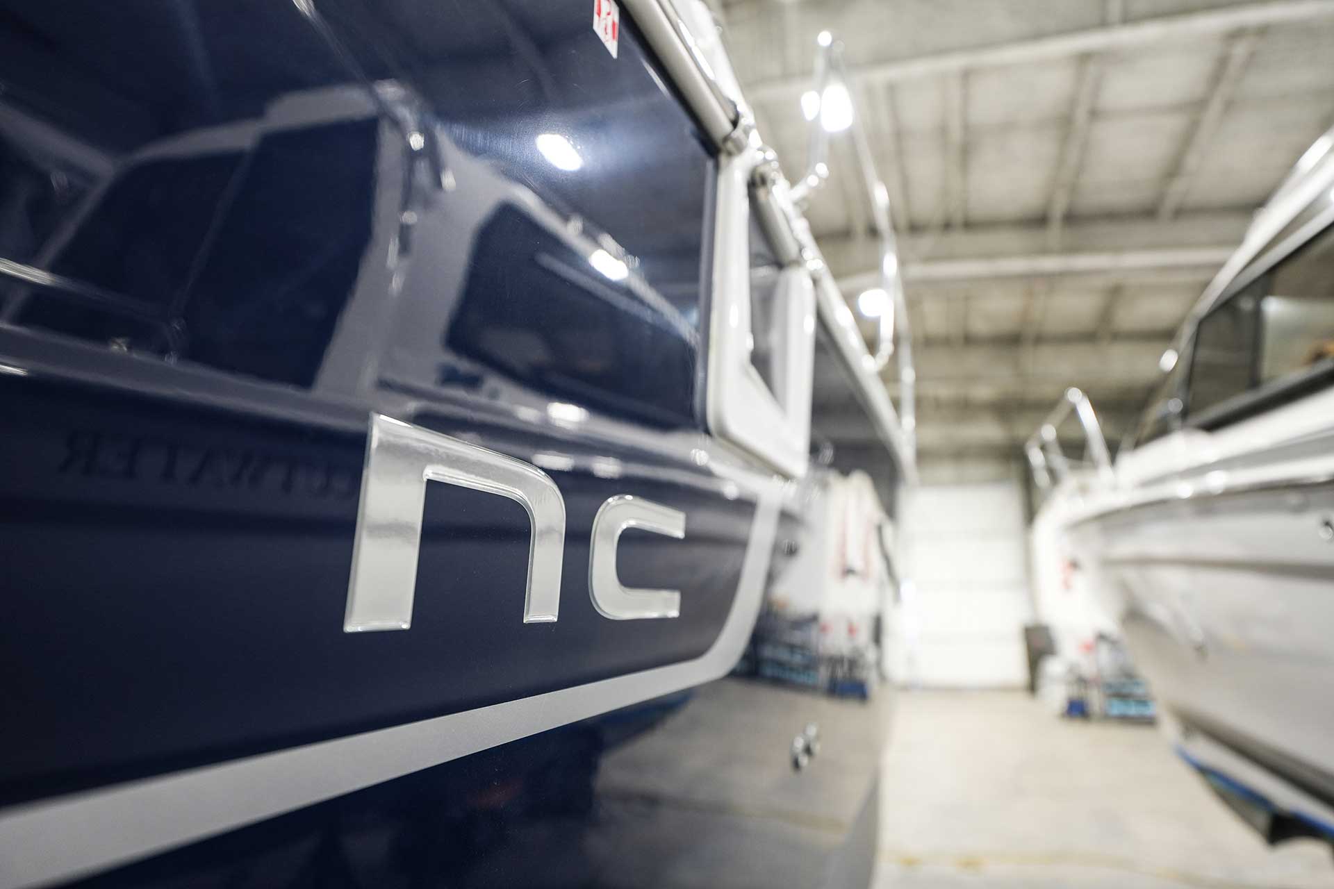 NC logo on the hull of a Jeanneau inside Sundance service shop